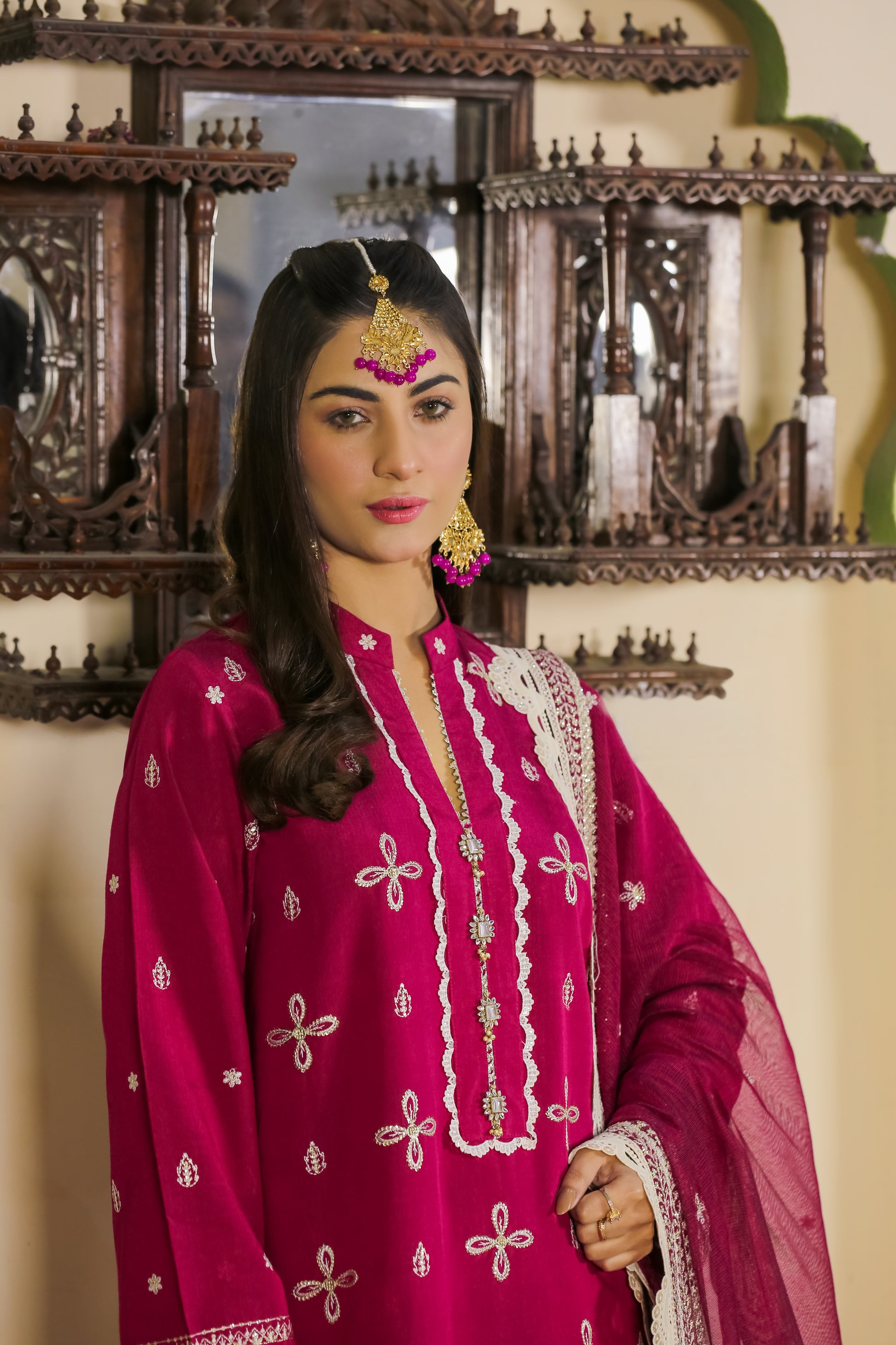 Model wearing Saadia Ahmed LWSU-25FE301 Embroidered Cotton Silk outfit in vibrant maroon with intricate embroidery