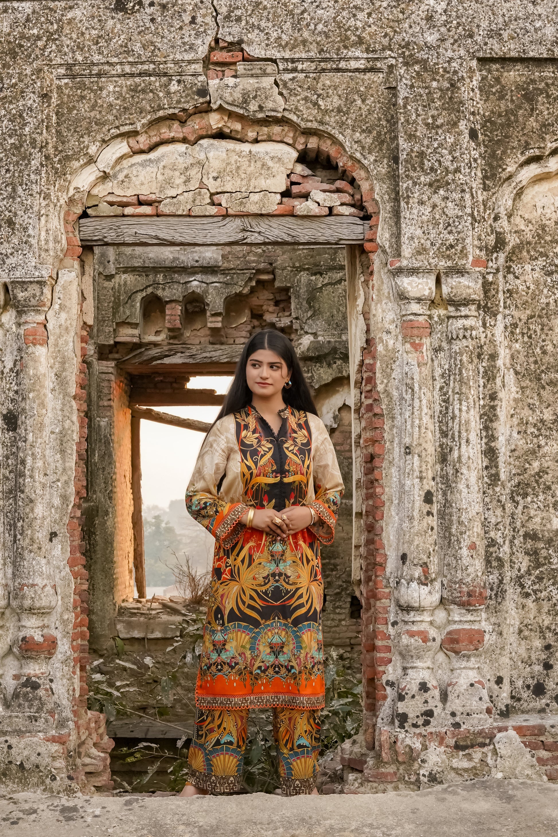 Saadia Ahmed LWSU-25P204 2-Pcs Printed Lawn featuring vibrant patterns and elegant design in a historic setting