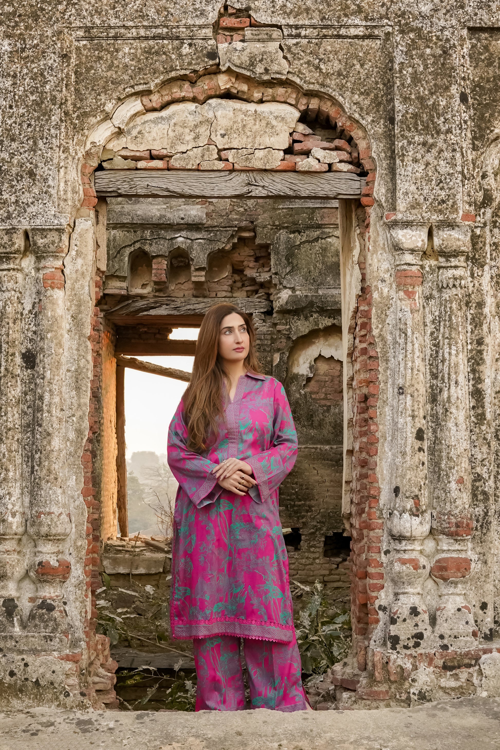 Saadia Ahmed LWSU-25P205 2-Pcs Printed Lawn Set Worn by a Model in a Ruined Structure