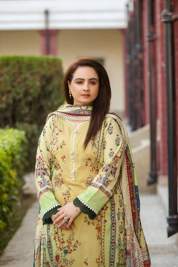 Model wearing Saadia Ahmed LWSU-25P311 3-Pcs Printed Lawn Suit in a garden setting with a stylish design
